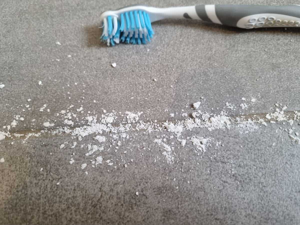 How to get drywall dust out of grout and tiles
